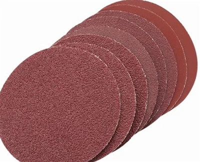 How does the uniformity of abrasive particle distribution on sandpaper affect...