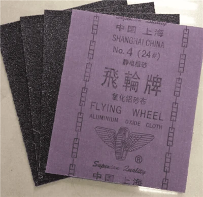 What are the main components of the Feilun brand aluminum oxide sanding discs?