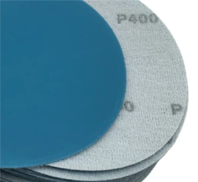 What role does the material of the polishing disc play in the adhesion and de...
